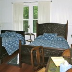 Waipio Wayside, Plantation Room, two bed and a table